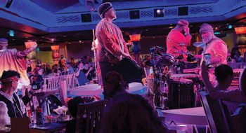 Performers in Pride Lands: Feast of the Lion King.