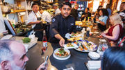Sinu Pillai serves a group of influencers during a Holland America Line tasting event in New York to celebrate the line's partnership with chef Masaharu Morimoto.