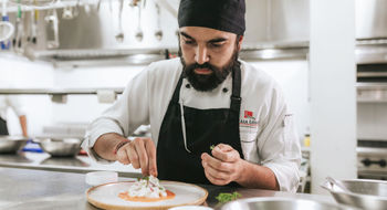 Chef Cristian Puente oversees culinary programming across Pikaia Lodge and the Vision Pikaia yacht.