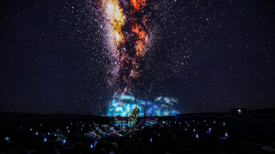 Inside the Sphere Theater, guests are immersed in 360-degree visuals during the "Mele" performance.