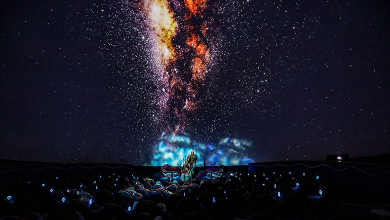 Inside the Sphere Theater, guests are immersed in 360-degree visuals during the "Mele" performance.