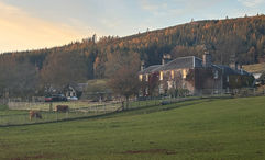 The sun sets over The Old Manse of Blair, a boutique hotel in the Scottish Highlands.