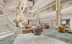The Oceania Sonata's atrium will have a white stairway, seafoam carpeting and a sculptural centerpiece.