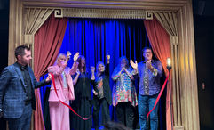 The Magic Castle team cut the ribbon at Spellbound on the Star Princess.